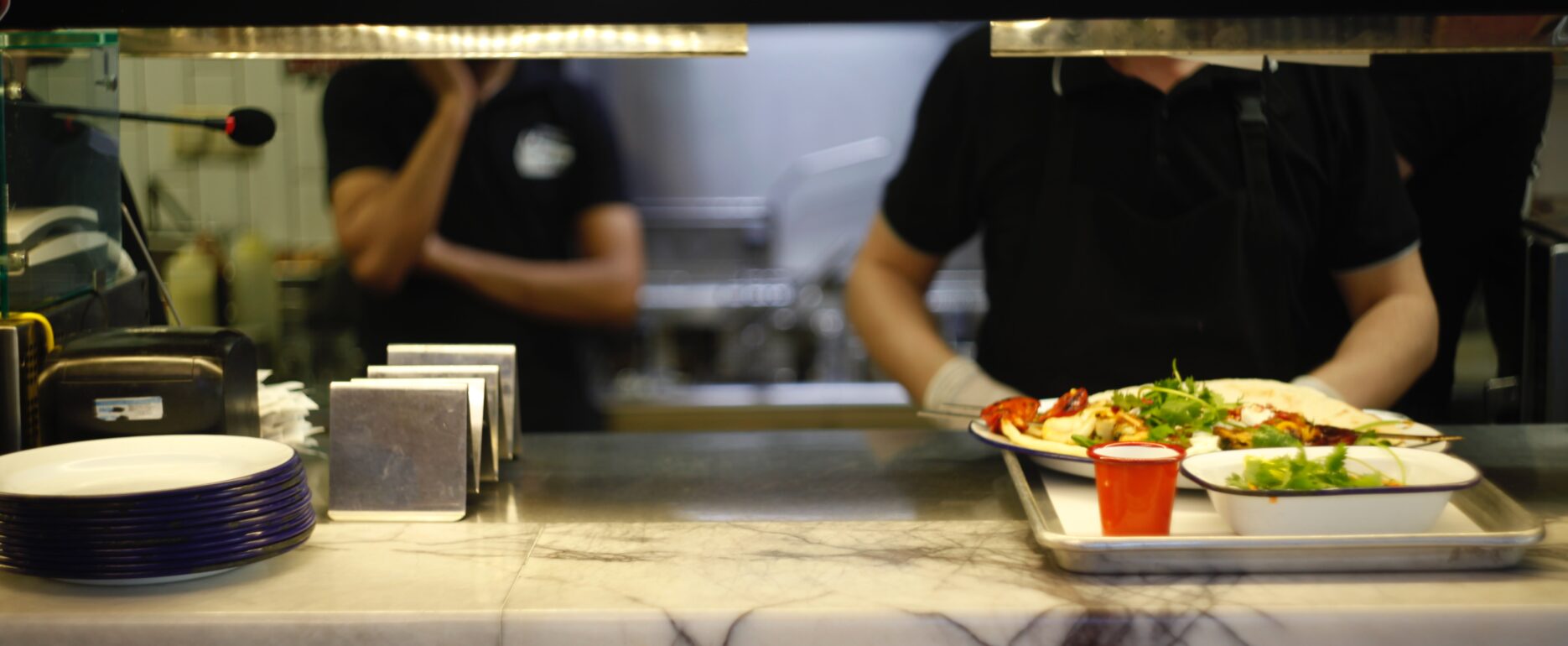 Photo of student in school lunch line unsplash (1)